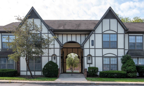 an exterior of a building with an English facade